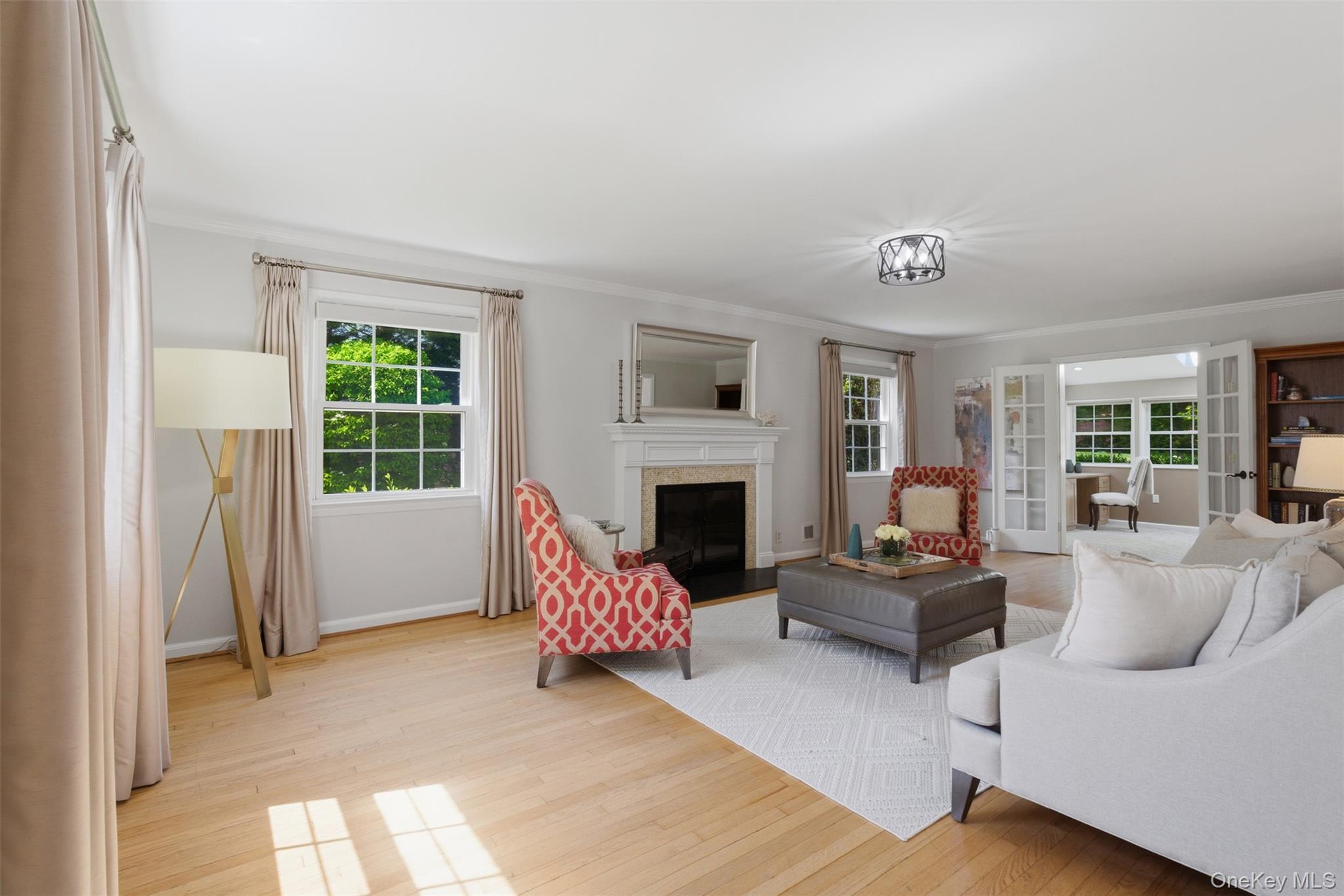 136 Devonshire Road Larchmont, NY 10538 - Photo 4 of 34 a living room with furniture and a fireplace