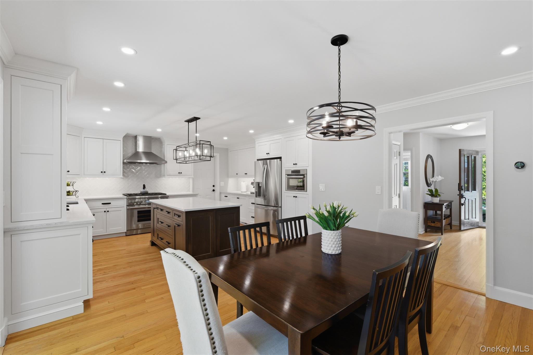 136 Devonshire Road Larchmont, NY 10538 - Photo 9 of 34 a dining room filled chandelier and kitchen view