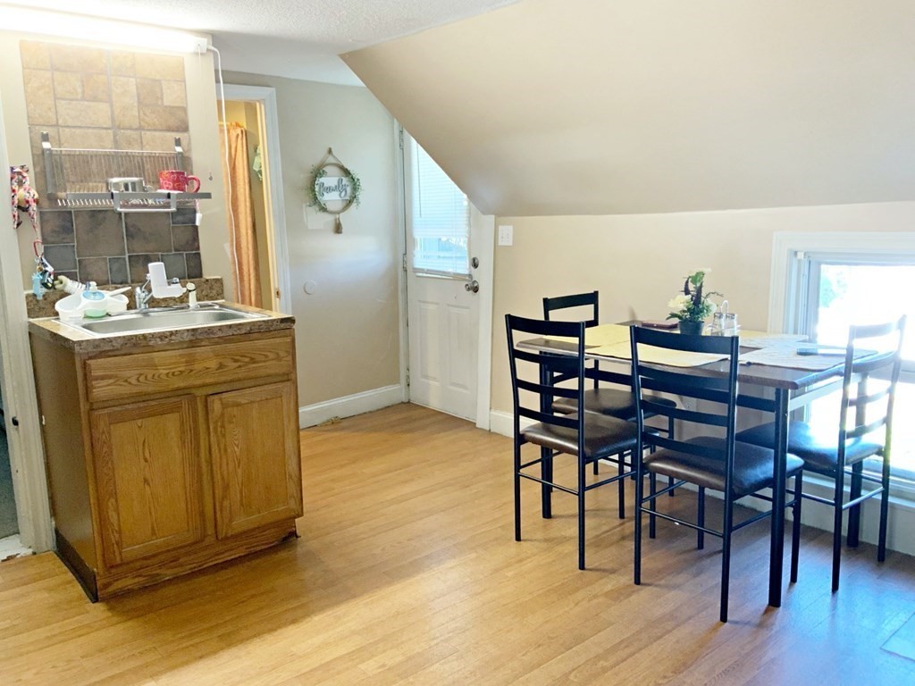 250 Main Street Springfield, MA 01151 - Photo 14 of 20 a dining room with furniture and wooden floor