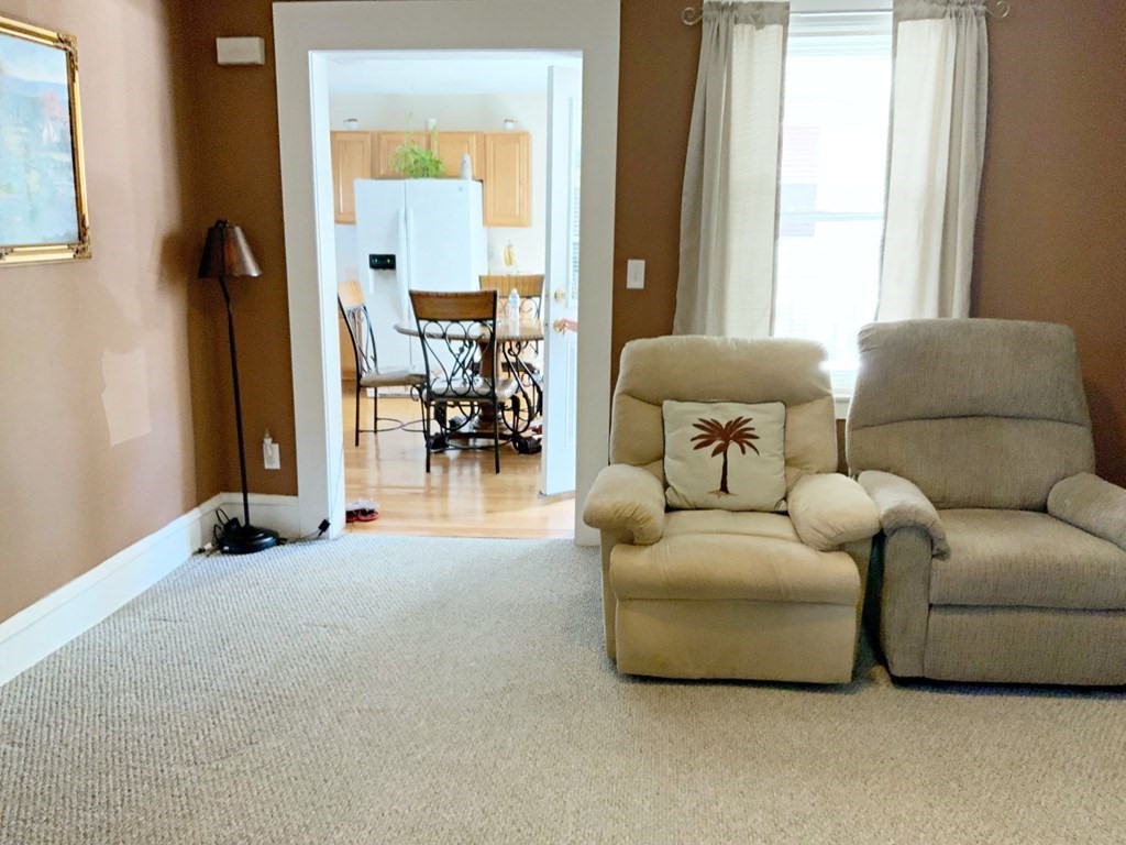 250 Main Street Springfield, MA 01151 - Photo 5 of 20 a living room with furniture and a large window