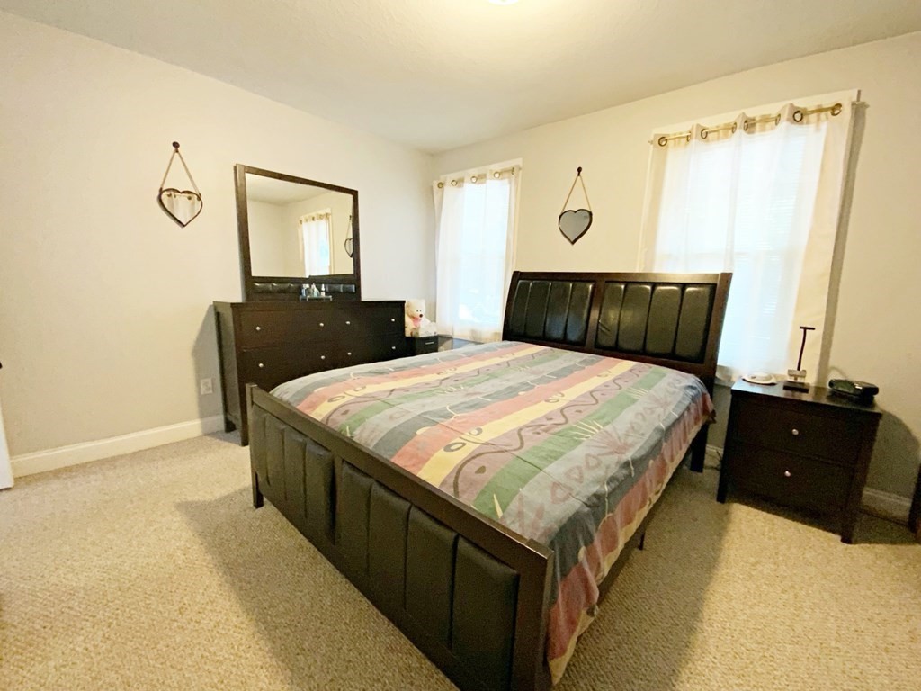 250 Main Street Springfield, MA 01151 - Photo 7 of 20 a bed room with a bed and a television