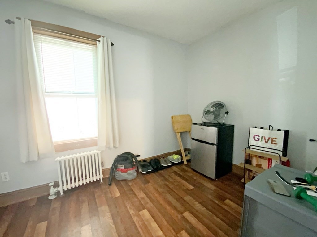 250 Main Street Springfield, MA 01151 - Photo 9 of 20 a bedroom with a bed and a window