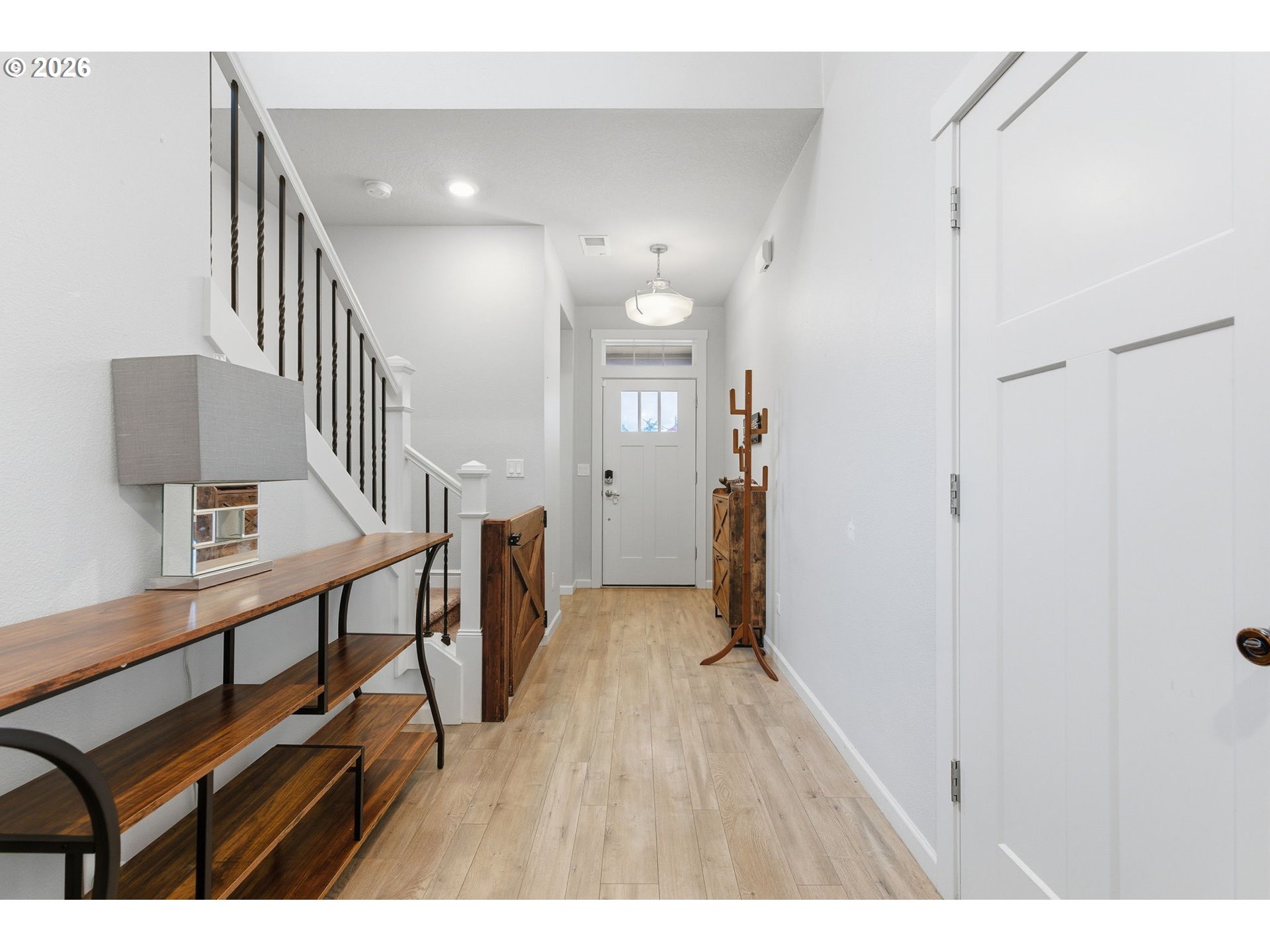 476 Southwest 15th Avenue Canby, OR 97013 - Photo 7 of 41 a view of hallway with wooden floor and stairs