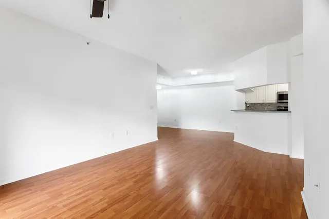 a bathroom with double vanity sinks and a mirror