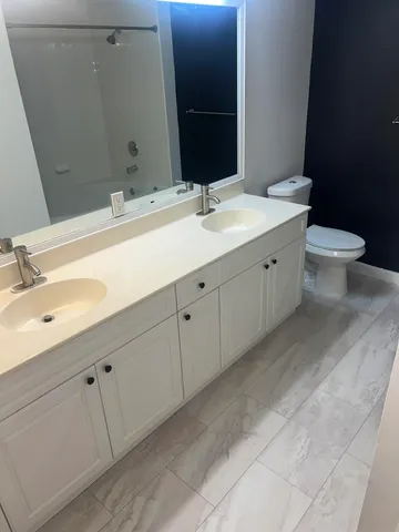 a view of a big room with closet and chandelier fan