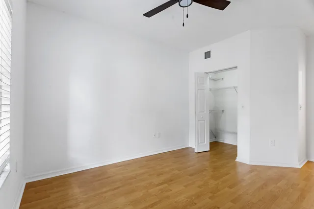 a kitchen with appliances a sink and cabinets