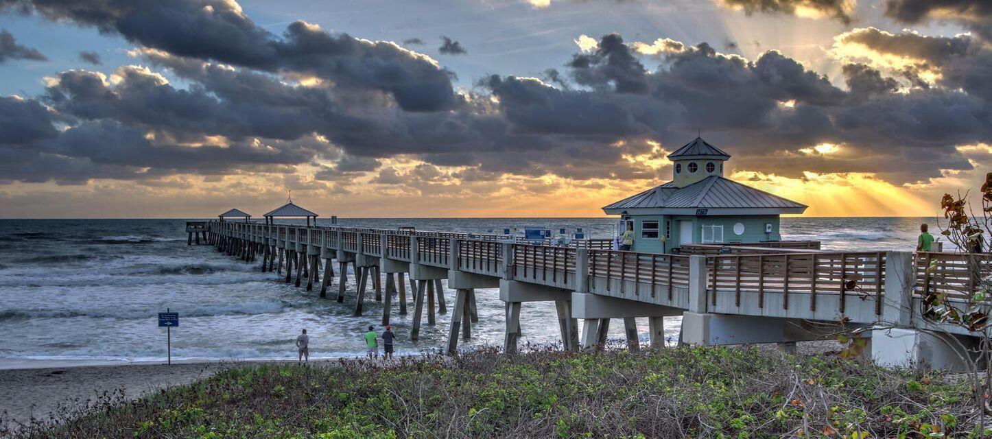 2725 Anzio Court, Unit 102 Palm Beach Gardens, FL 33410 - Photo 31 of 33 a view of a building with a yard
