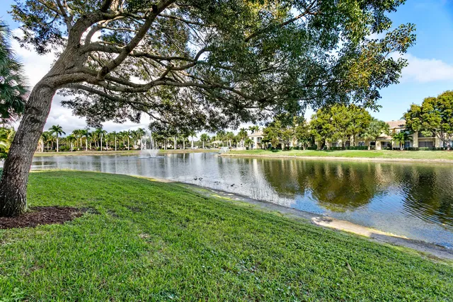 a view of a lake with a house in the background