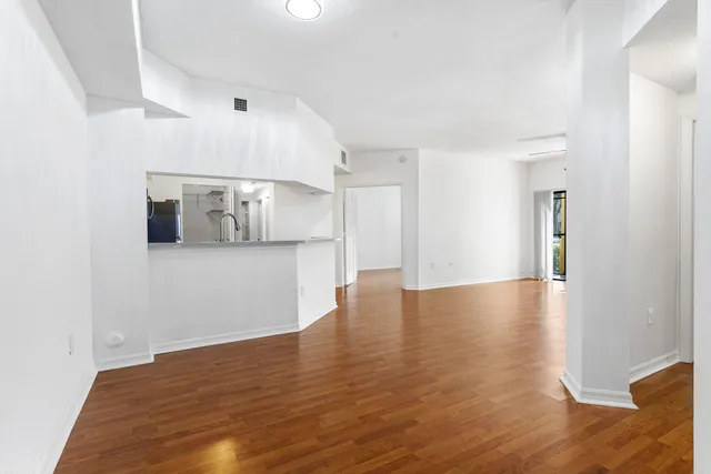 a bedroom with a bed a couch and a window