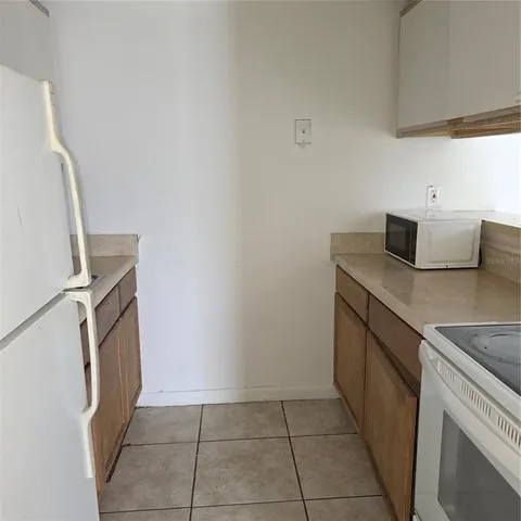 a utility room with sink dryer and washer