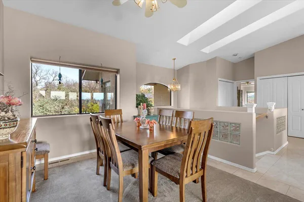 a view of a dining room with furniture and a livingroom
