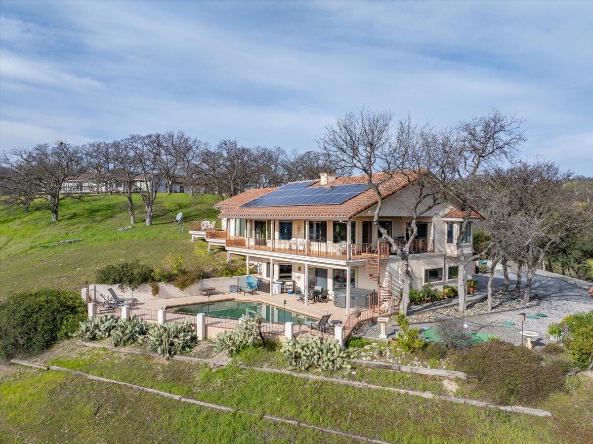 22560 Adobe Road Red Bluff, CA 96080 - Photo 2 of 48 a view of a big house with a big yard and large trees