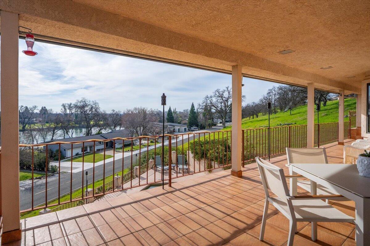 22560 Adobe Road Red Bluff, CA 96080 - Photo 30 of 49 a view of a balcony with lake view and wooden floor
