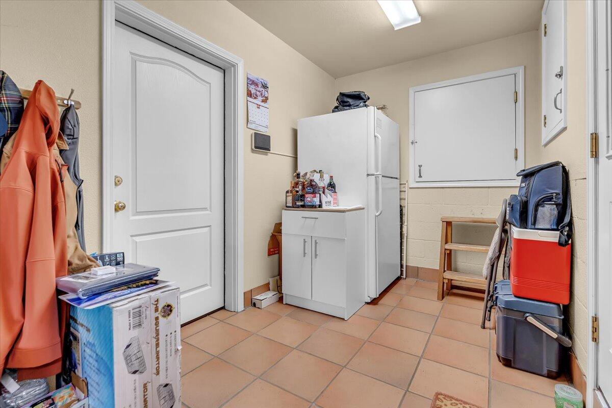 22560 Adobe Road Red Bluff, CA 96080 - Photo 32 of 49 a view of a storage and utility room with two washing machine