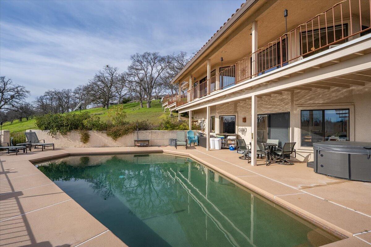 22560 Adobe Road Red Bluff, CA 96080 - Photo 35 of 49 a view of a house with sitting area and swimming pool