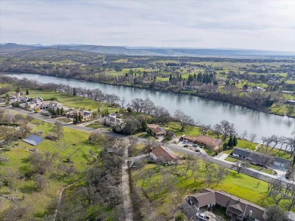 an aerial view of a house with a lake view