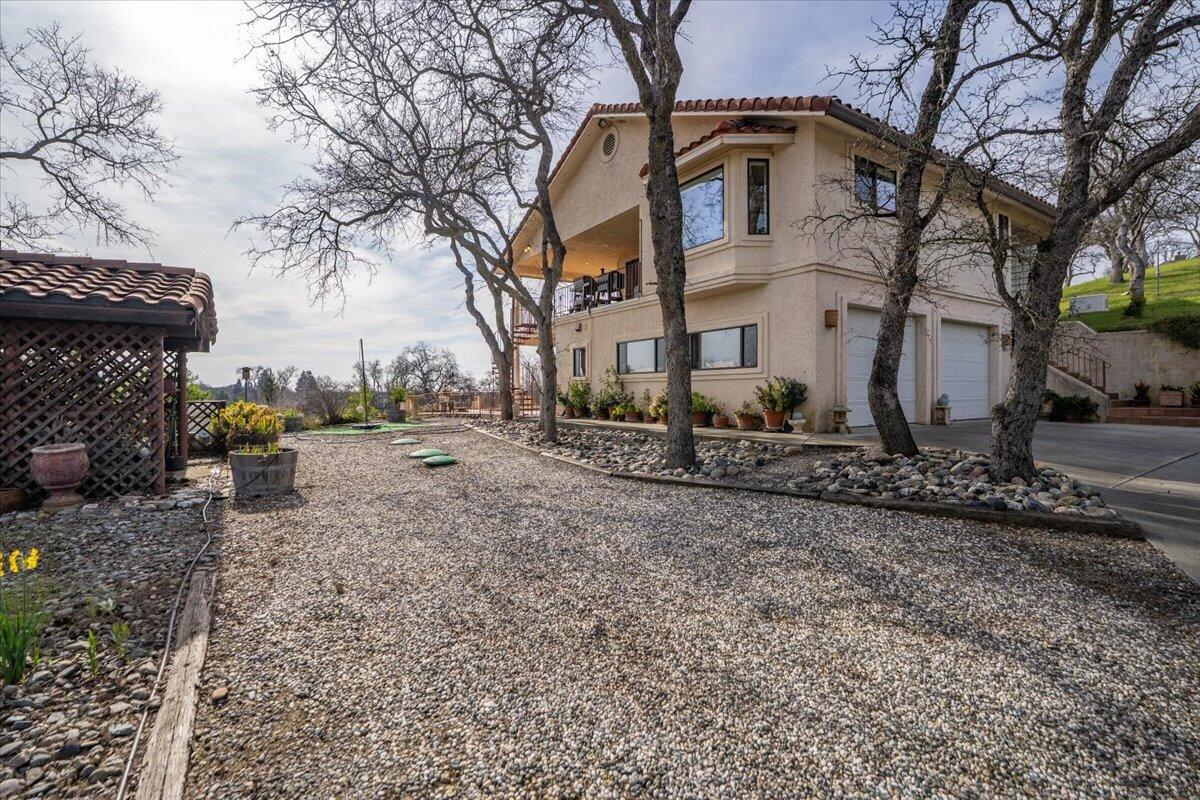 22560 Adobe Road Red Bluff, CA 96080 - Photo 43 of 48 a view of a white house with a street