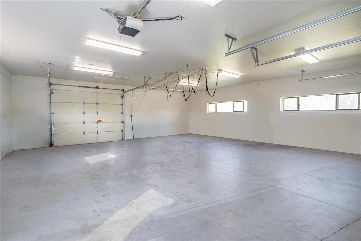 22560 Adobe Road Red Bluff, CA 96080 - Photo 45 of 49 an empty room with garage and wooden ceiling fan