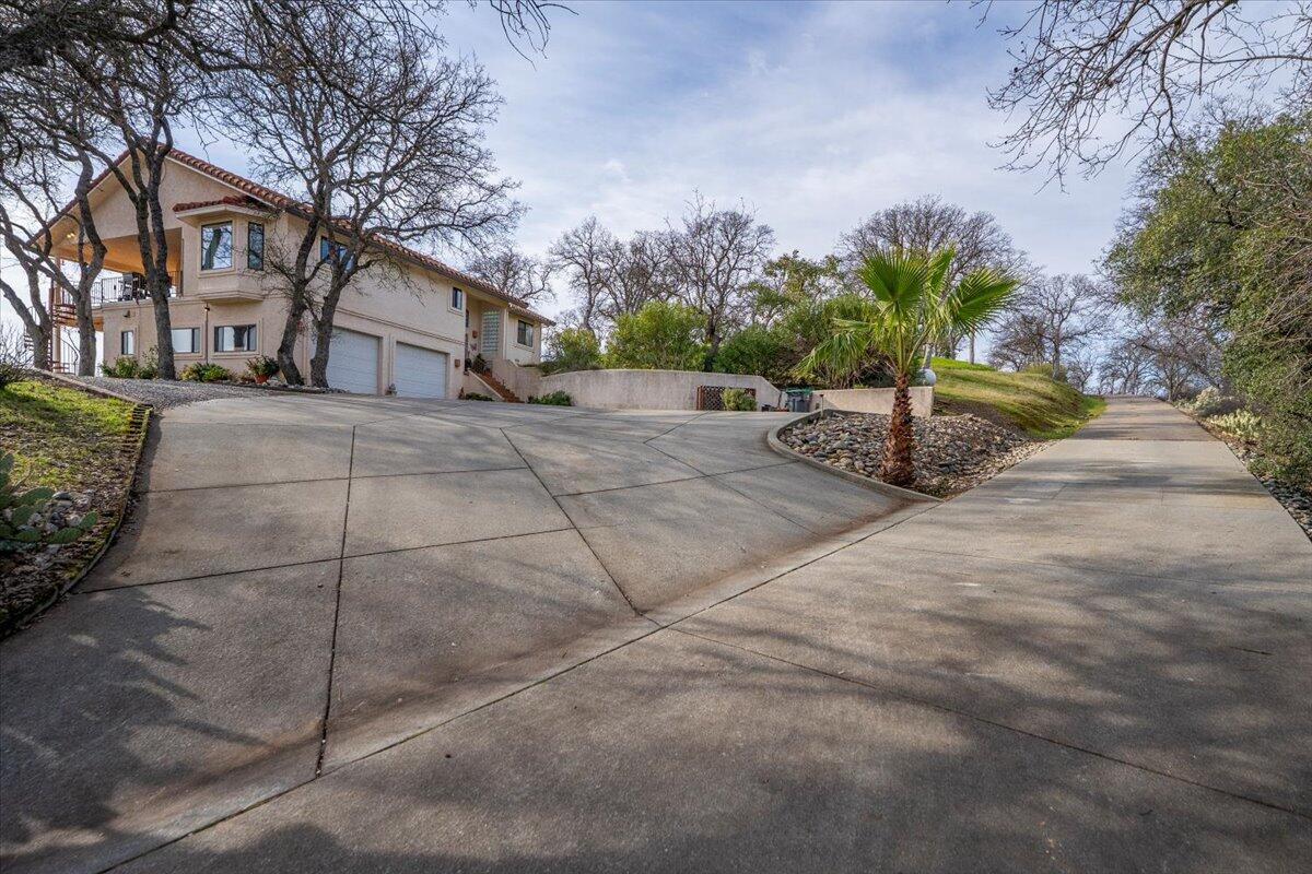22560 Adobe Road Red Bluff, CA 96080 - Photo 47 of 48 a front view of a house with a yard and garage