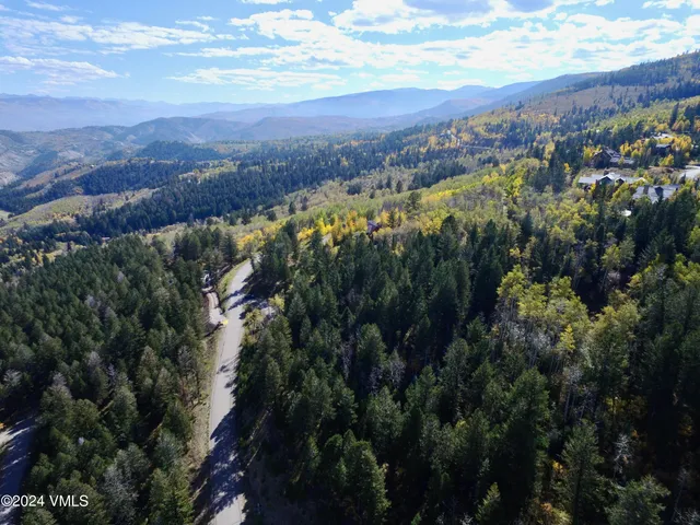a view of a city with mountains in the background