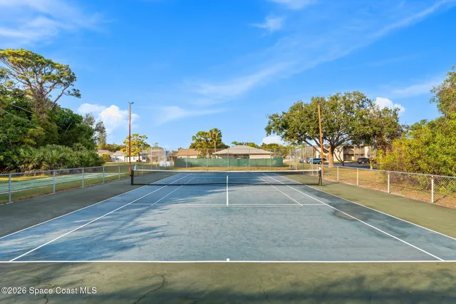 a house with trees in the background
