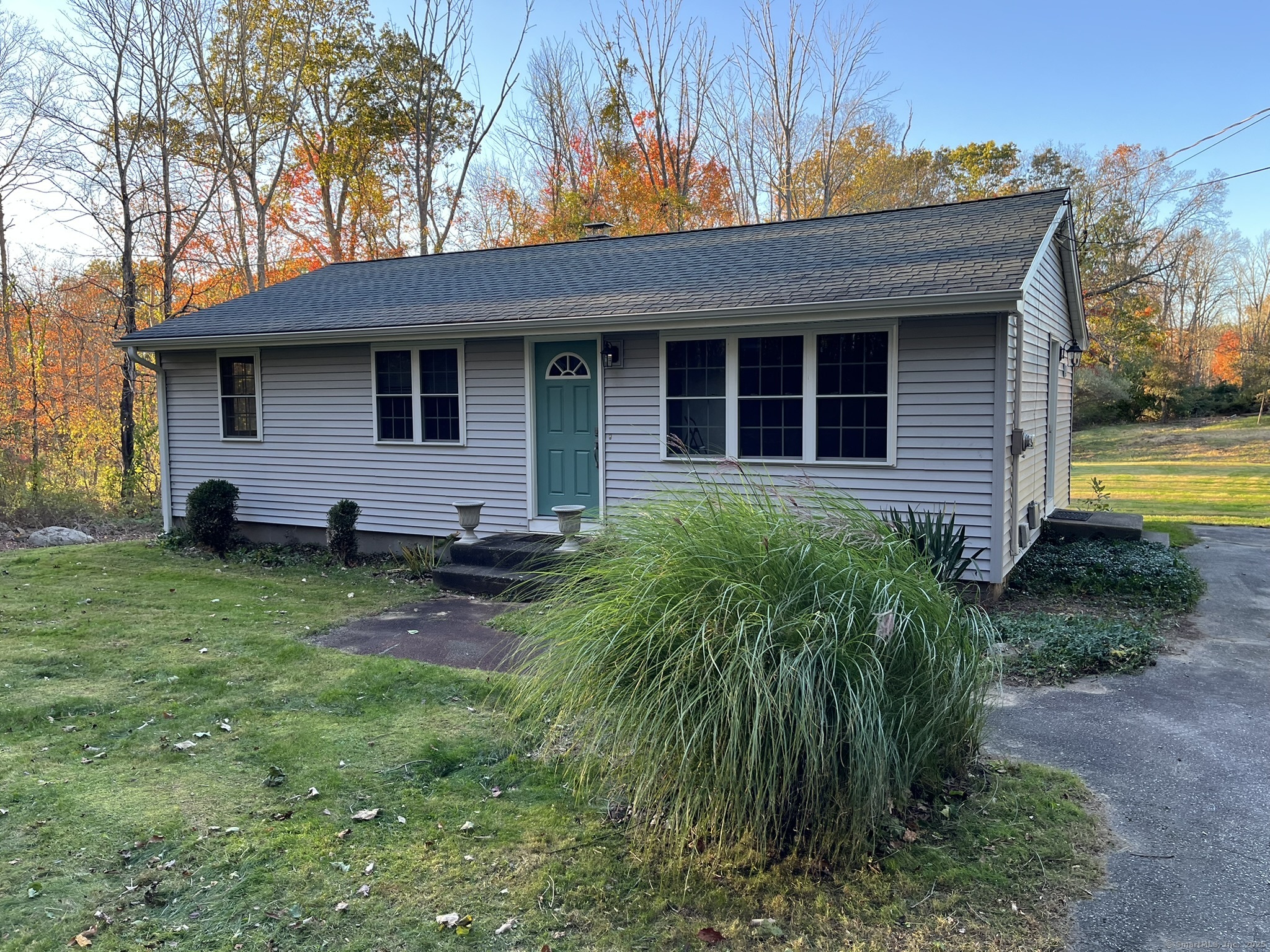 a backyard of a house with seating space