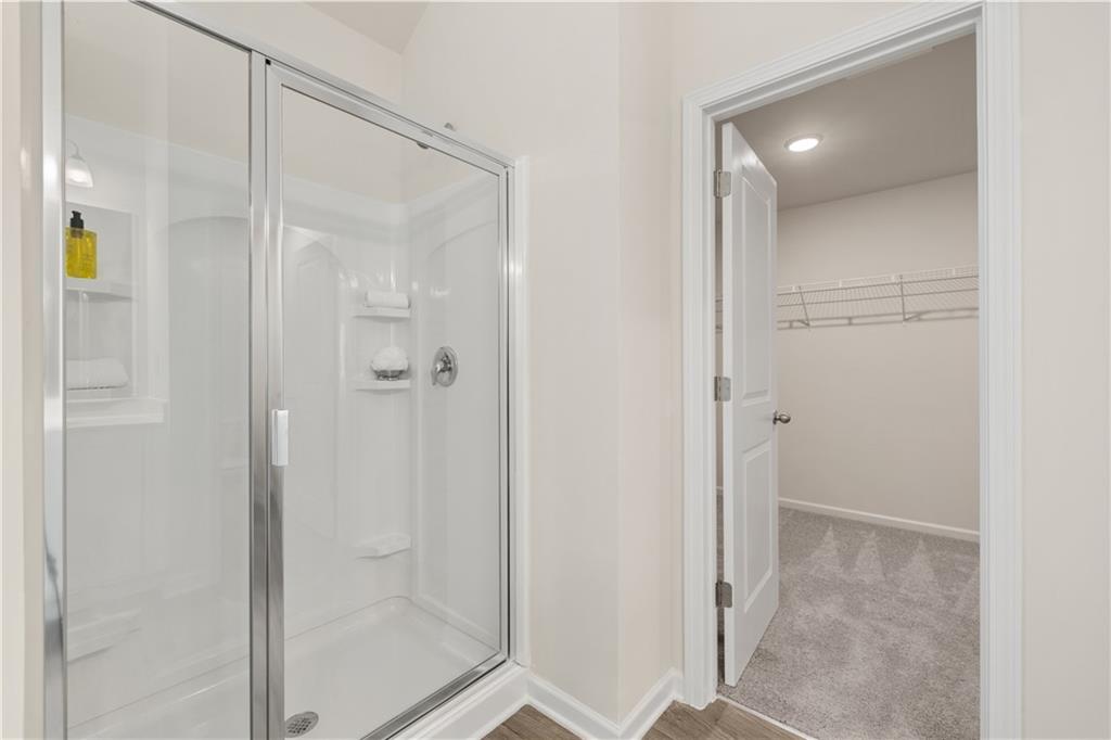2719 Riverpine Trail Atlanta, GA 30331 - Photo 13 of 16 a bathroom with a glass shower door