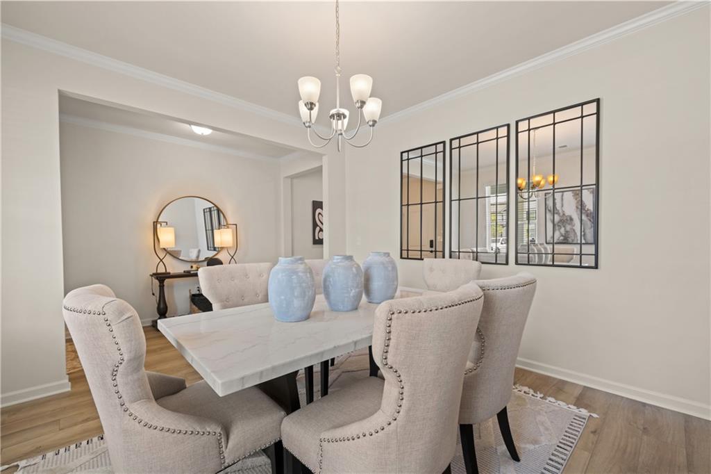 2719 Riverpine Trail Atlanta, GA 30331 - Photo 5 of 16 a view of a dining room with furniture and chandelier