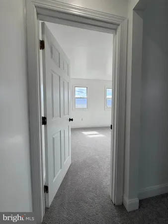 an empty room with windows and window