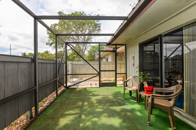 a view of swimming pool with a patio and a yard