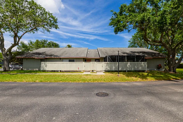 a view of swimming pool and trees in the background