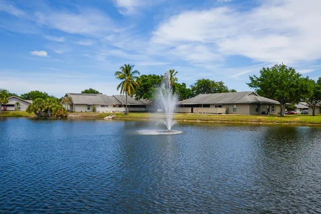 a view of swimming pool with outdoor seating and yard in back