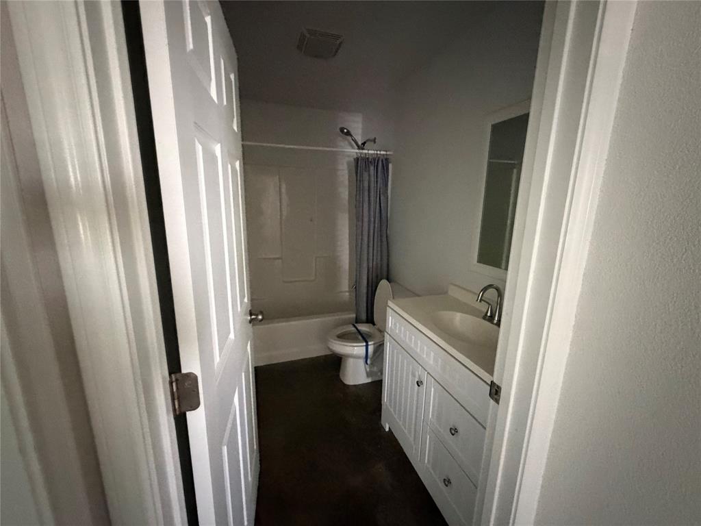 712 Seven Oaks Road, Unit 712 Bonham, TX 75418 - Photo 11 of 14 a bathroom with a sink a toilet and a shower