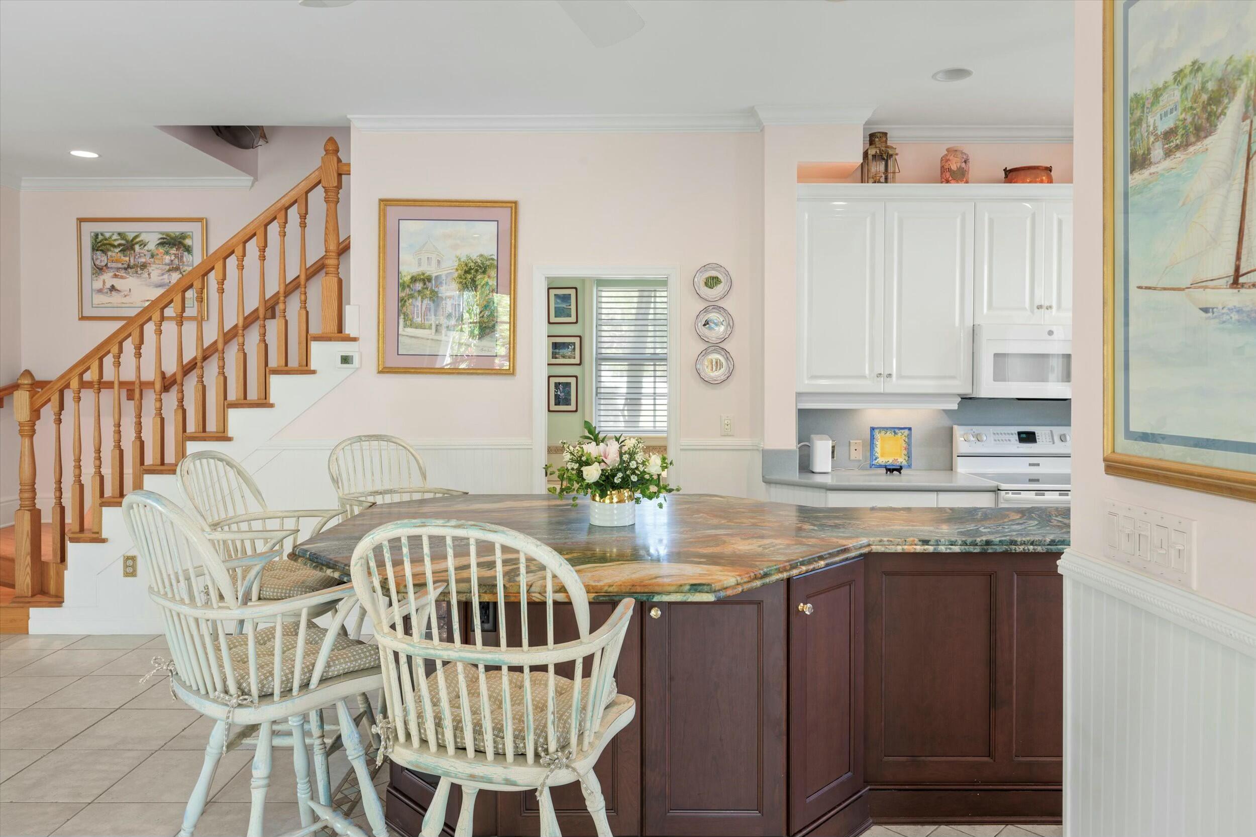 68 Sunset Key Drive Key West, FL 33040 - Photo 23 of 69 a view of a kitchen with granite countertop a table and chairs