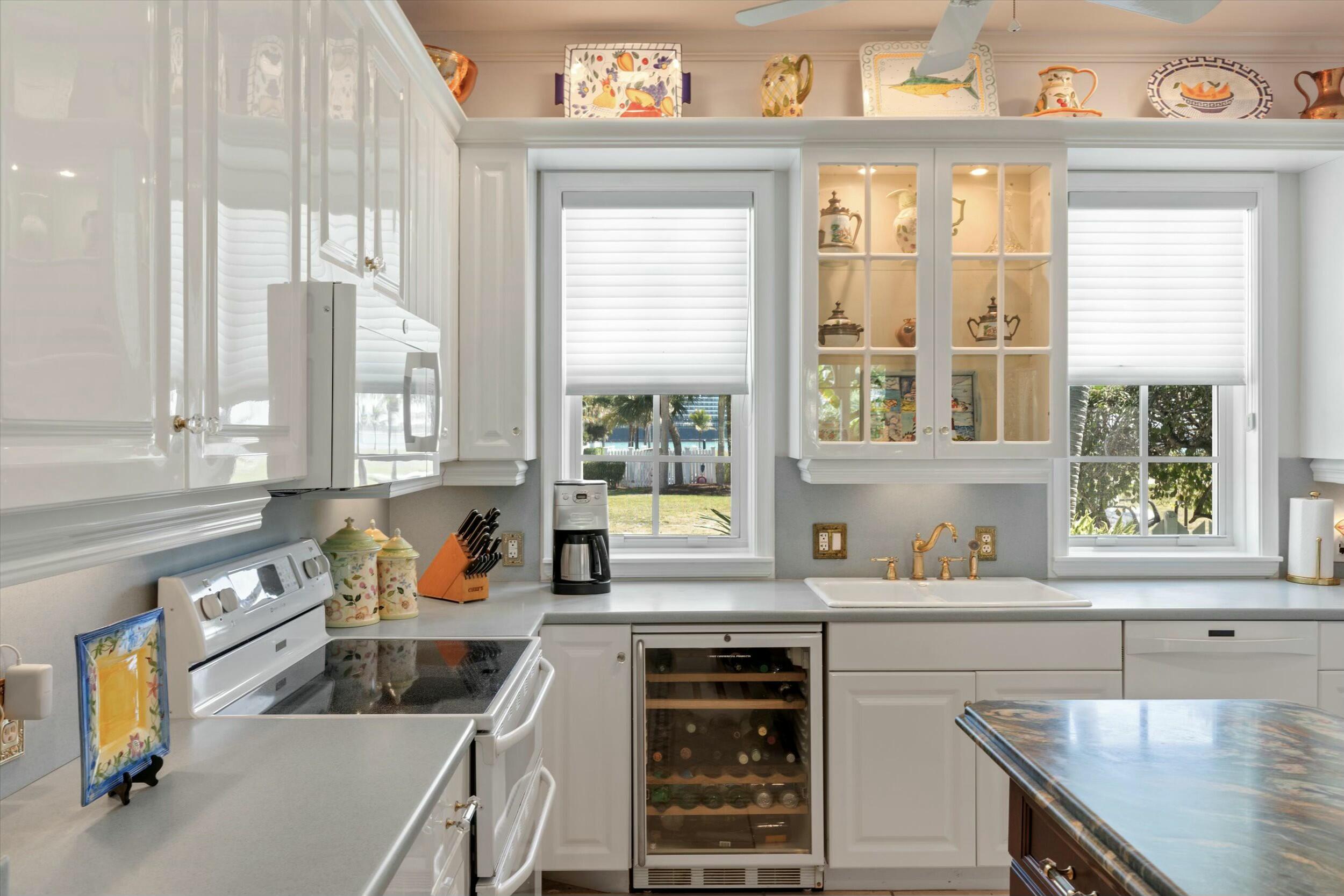 68 Sunset Key Drive Key West, FL 33040 - Photo 25 of 69 a kitchen with a window a sink and a cabinets