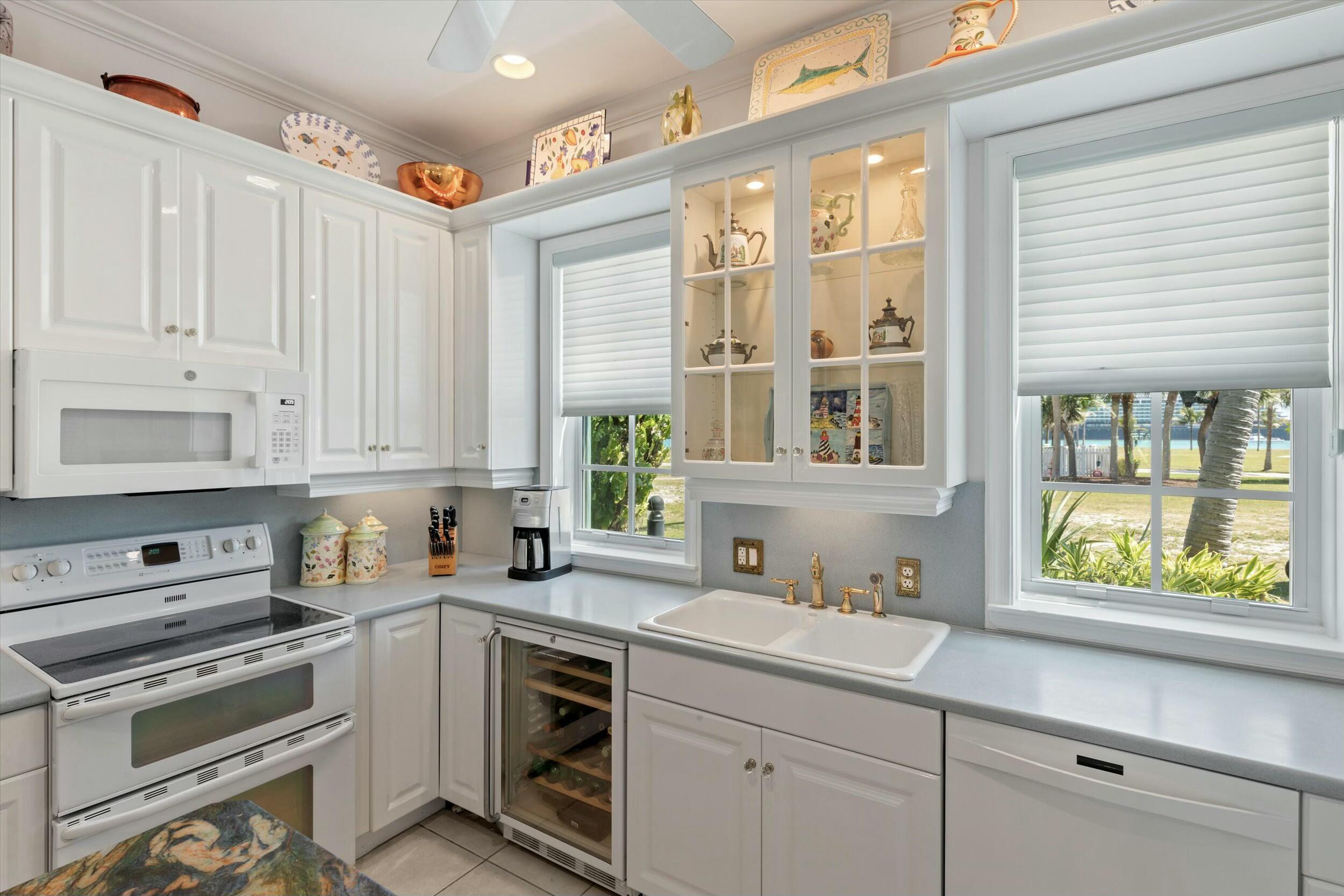 68 Sunset Key Drive Key West, FL 33040 - Photo 27 of 69 a kitchen with a sink stove and cabinets