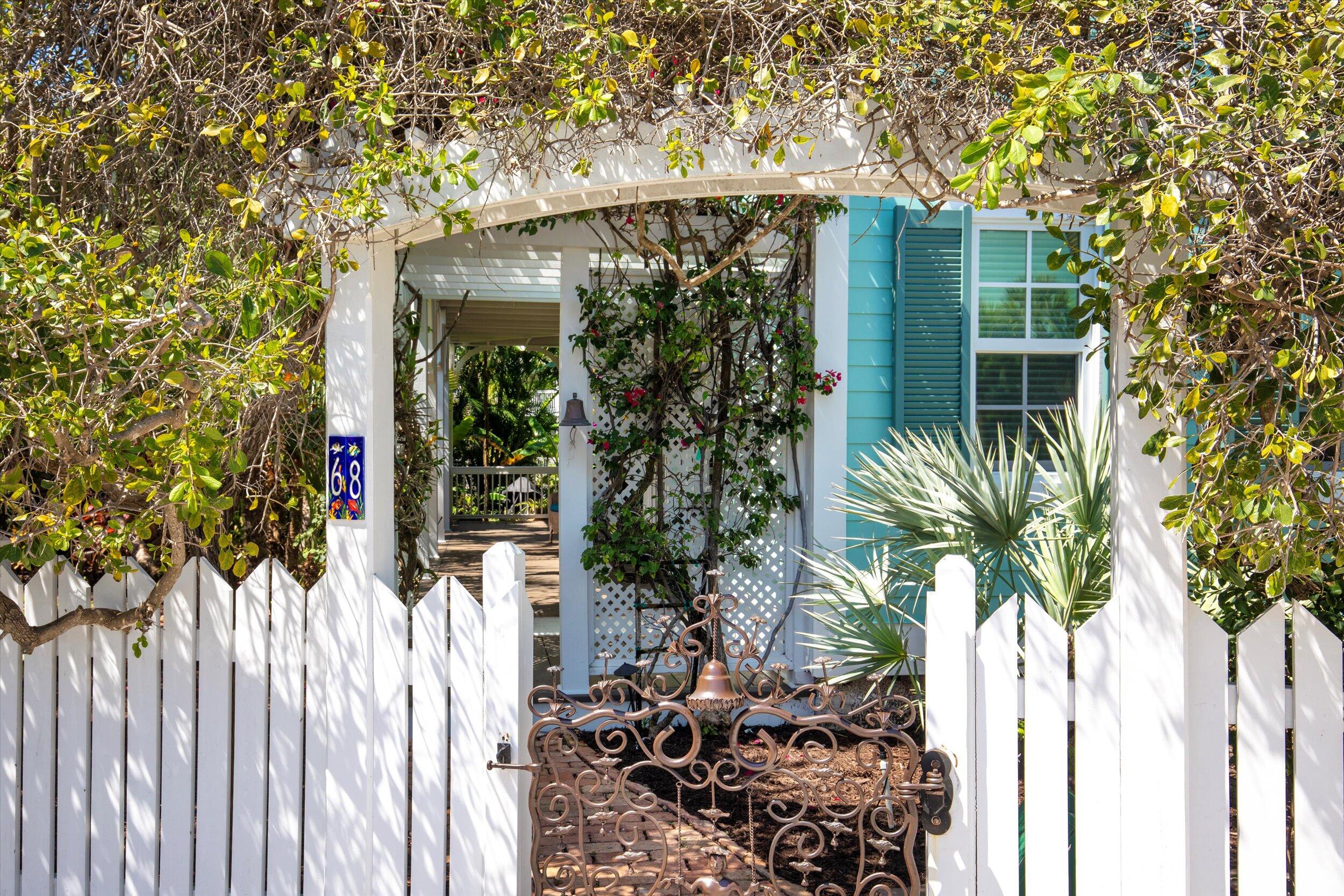 68 Sunset Key Drive Key West, FL 33040 - Photo 3 of 69 a couple of flower plants in front of building