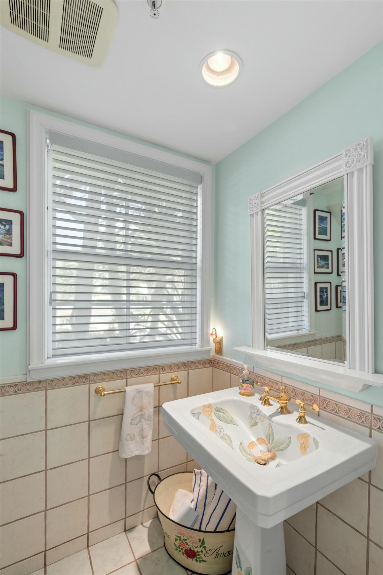 68 Sunset Key Drive Key West, FL 33040 - Photo 31 of 69 a bathroom with a sink a toilet a window and bathtub