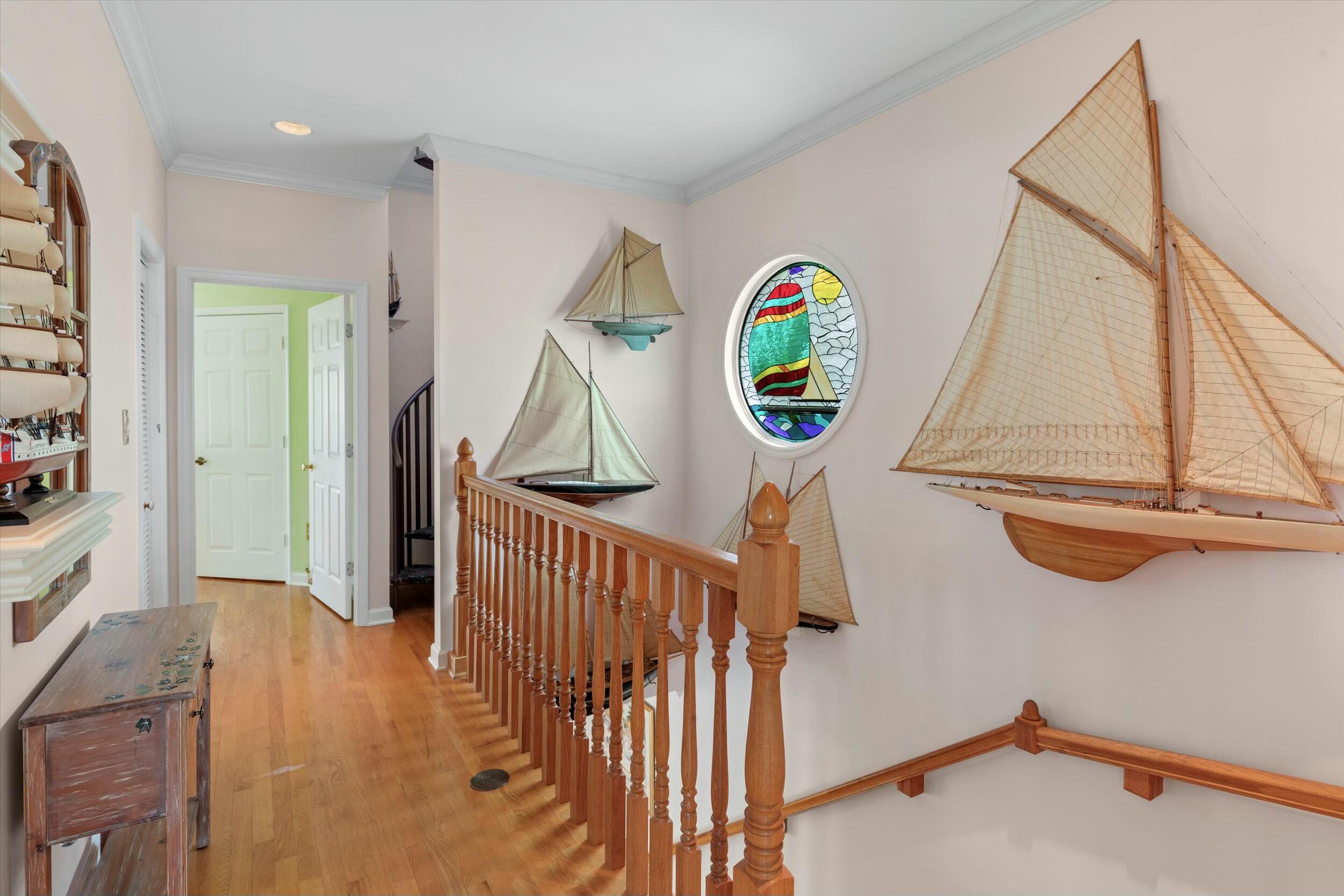 68 Sunset Key Drive Key West, FL 33040 - Photo 32 of 69 a view of a hallway with entryway wooden floor and front door