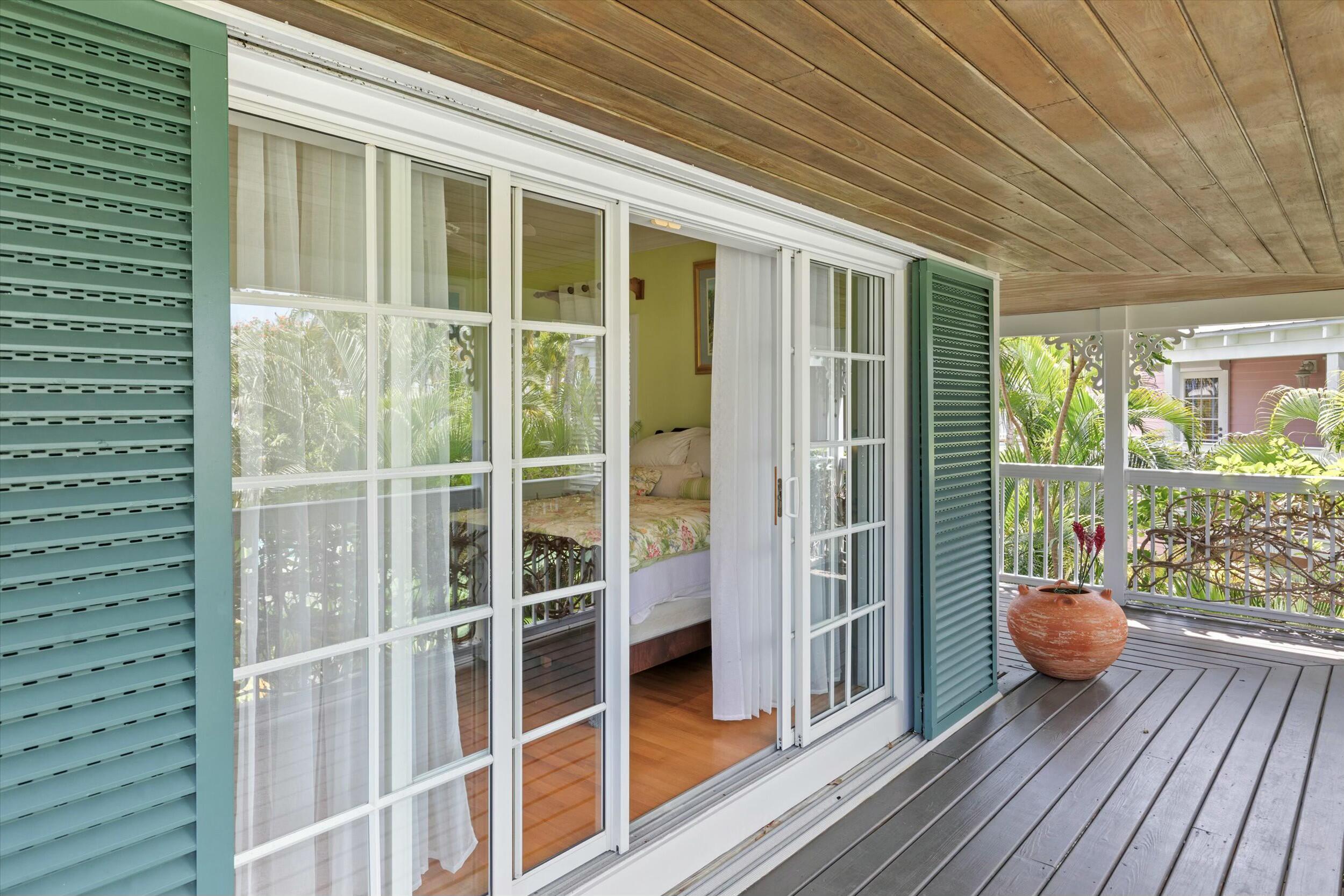 68 Sunset Key Drive Key West, FL 33040 - Photo 37 of 69 a view of a balcony with wooden floor