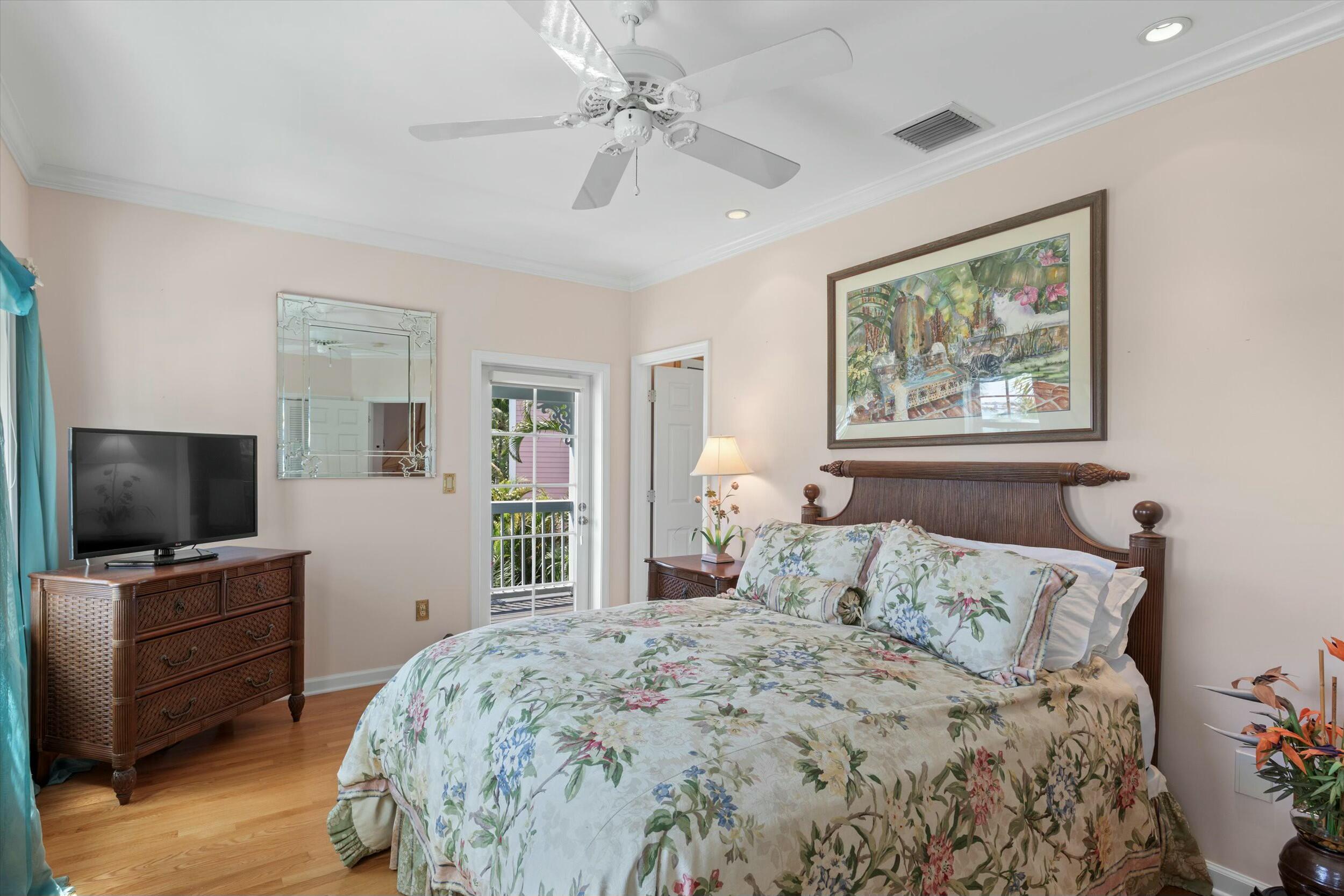 68 Sunset Key Drive Key West, FL 33040 - Photo 46 of 69 a bedroom with a large bed and a flat screen tv