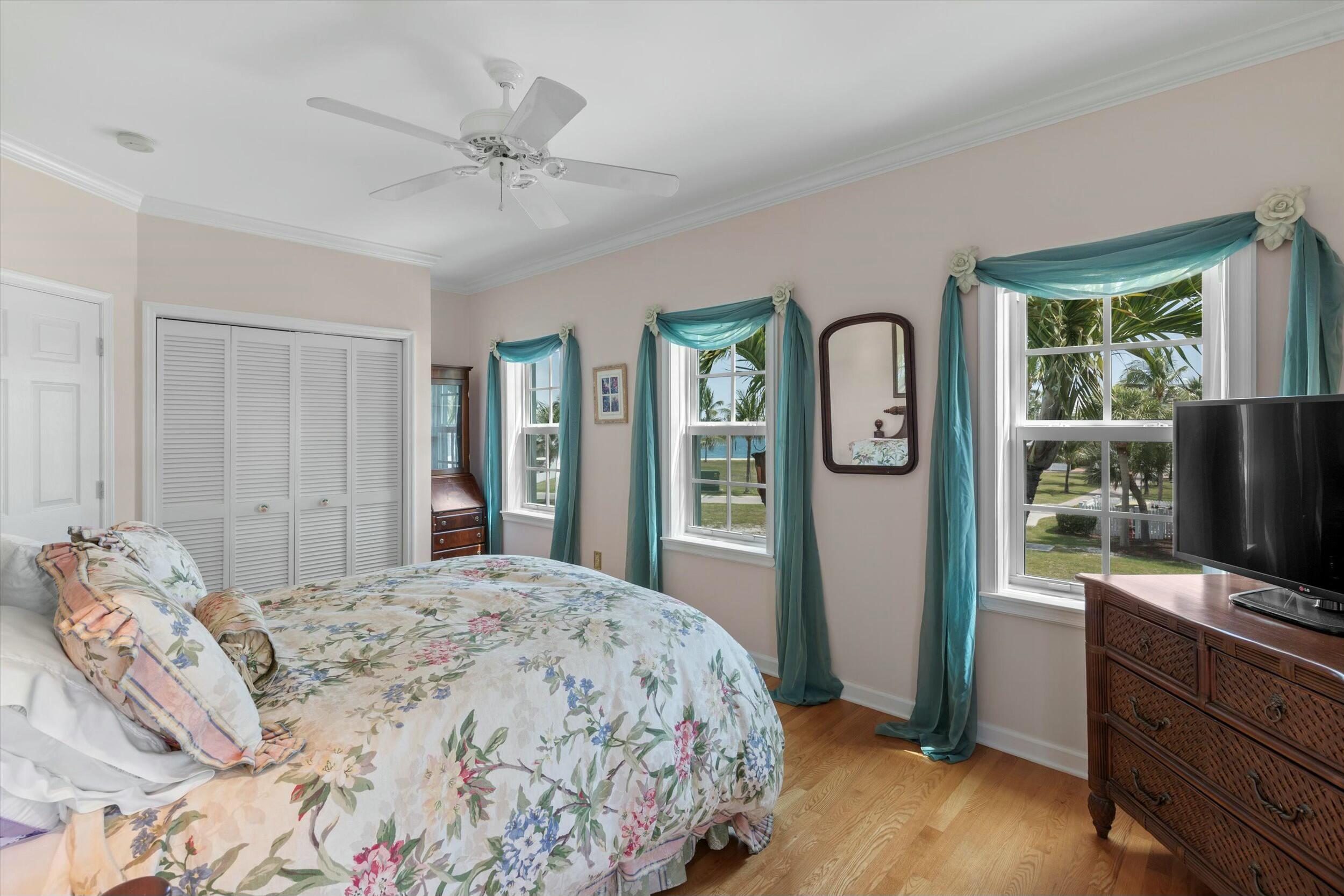 68 Sunset Key Drive Key West, FL 33040 - Photo 47 of 69 a bedroom with a bed and a flat screen tv