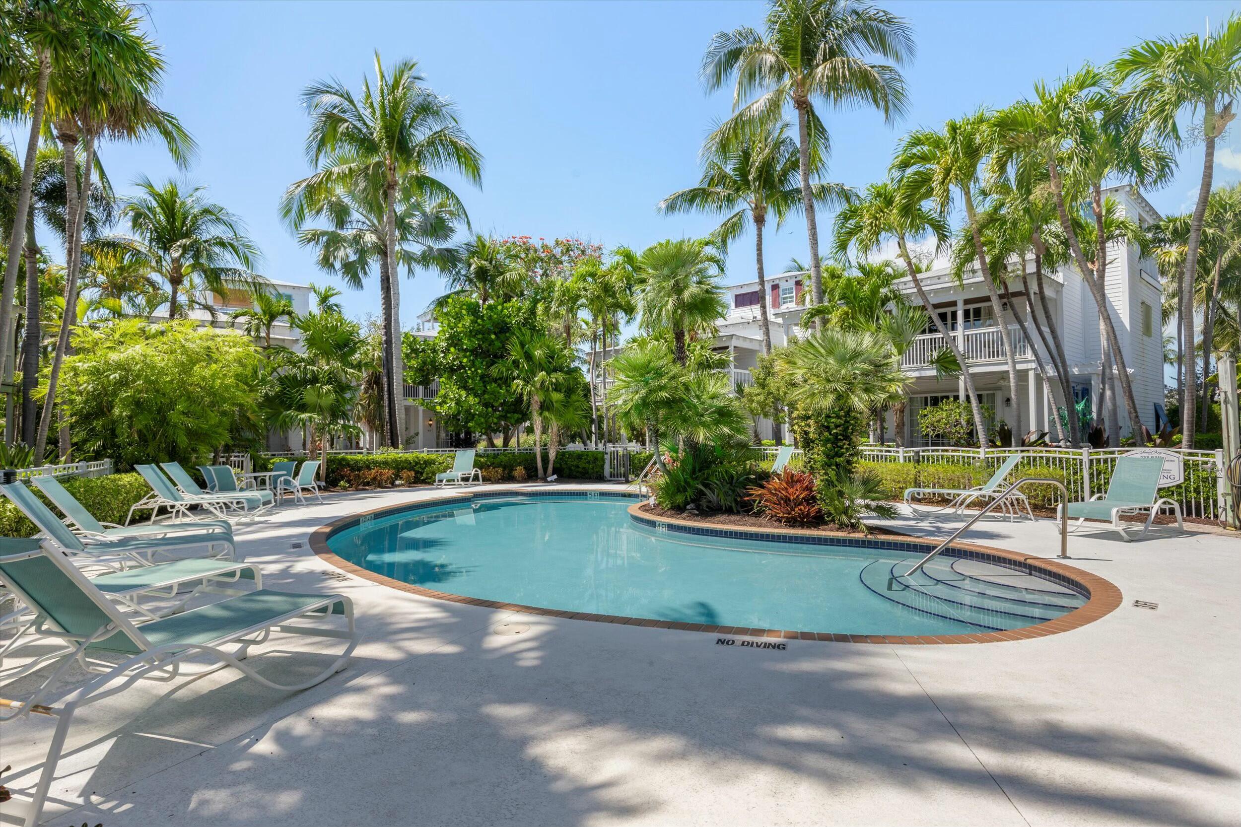 68 Sunset Key Drive Key West, FL 33040 - Photo 64 of 69 a view of a swimming pool with a patio