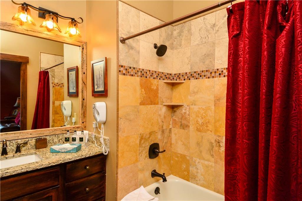 129 River Run Road, Unit 8073 Keystone, CO 80435 - Photo 10 of 16 a bathroom with a sink and a mirror