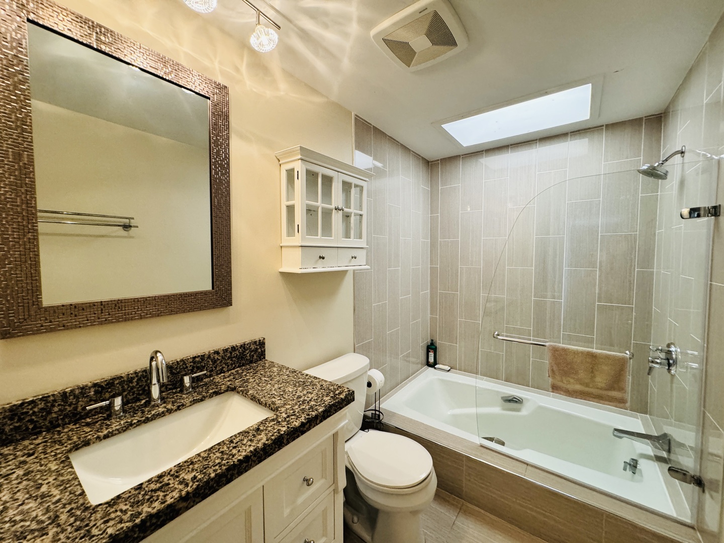 4279 Hilltop Road Long Grove, IL 60047 - Photo 13 of 21 a bathroom with a granite countertop sink a toilet a mirror and shower
