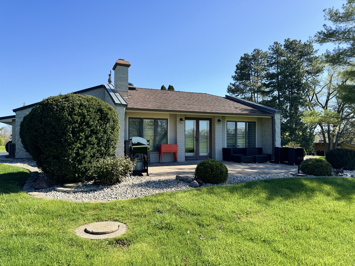 4279 Hilltop Road Long Grove, IL 60047 - Photo 18 of 21 a front view of a house with garden