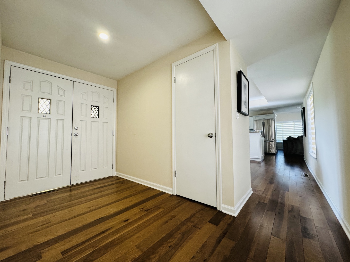 4279 Hilltop Road Long Grove, IL 60047 - Photo 3 of 21 a view of a hallway with wooden floor