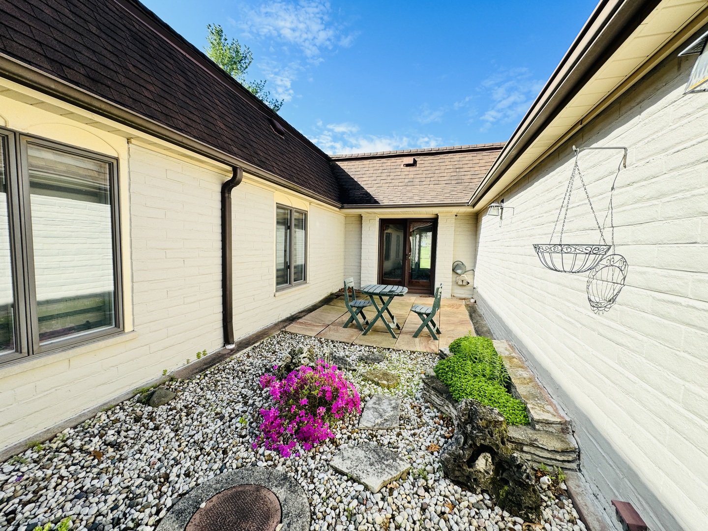 4279 Hilltop Road Long Grove, IL 60047 - Photo 9 of 21 a front view of a house with a flower garden