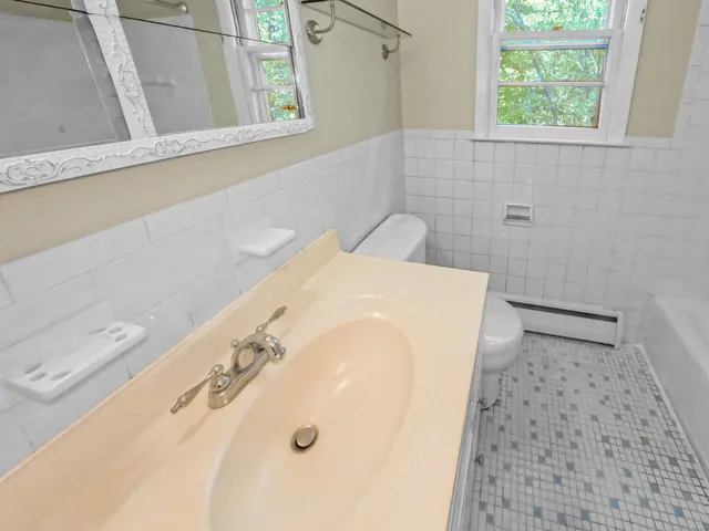 a bathroom with a shower and tub