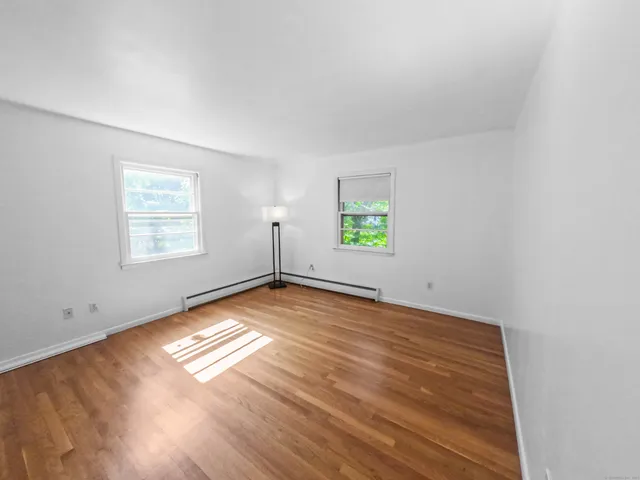 a view of a room with gym equipment and a window